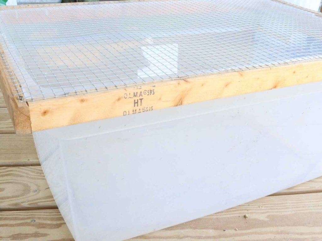 plastic storage tote with lid made from wood frame and hardware cloth