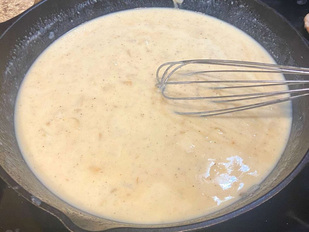 creamy colored milk based filling in cast iron skillet