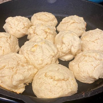 golden brown drop biscuits in cast iron skillet