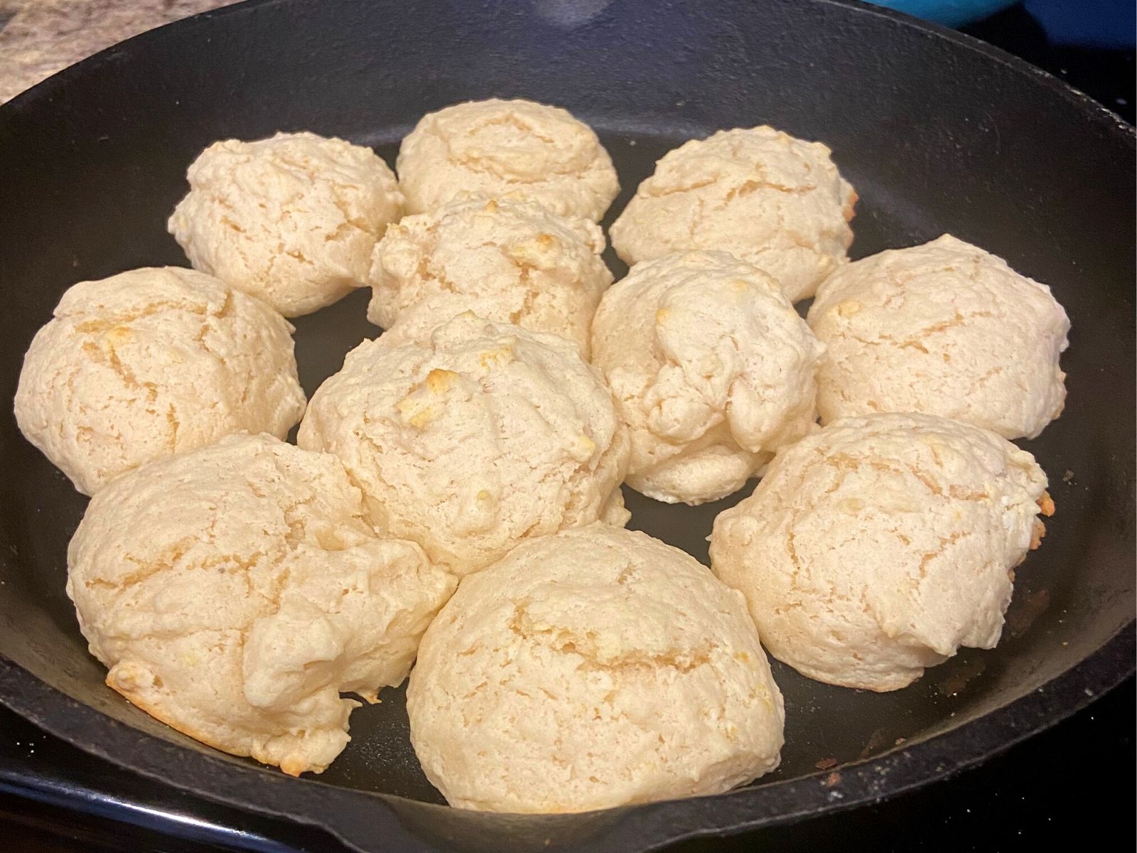 golden brown drop biscuits in cast iron skillet