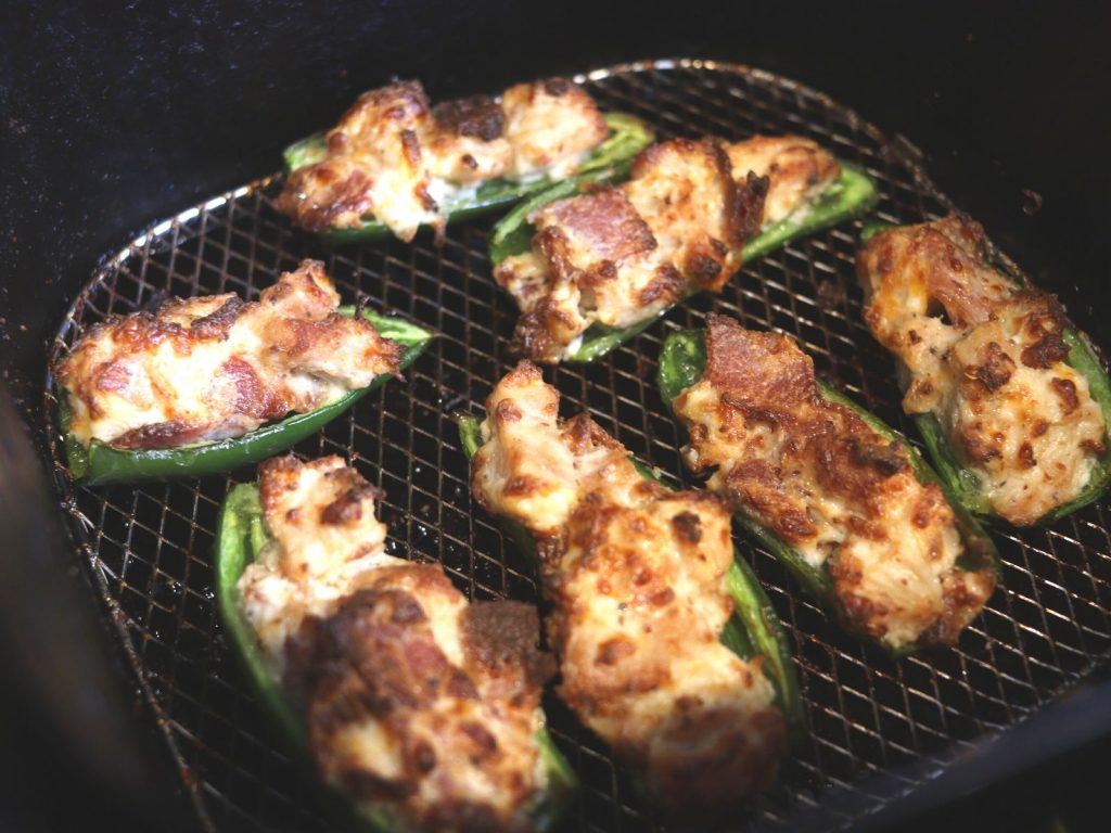 jalapeno peppers stuffed with cheese, bacon, and chicken in air fryer
