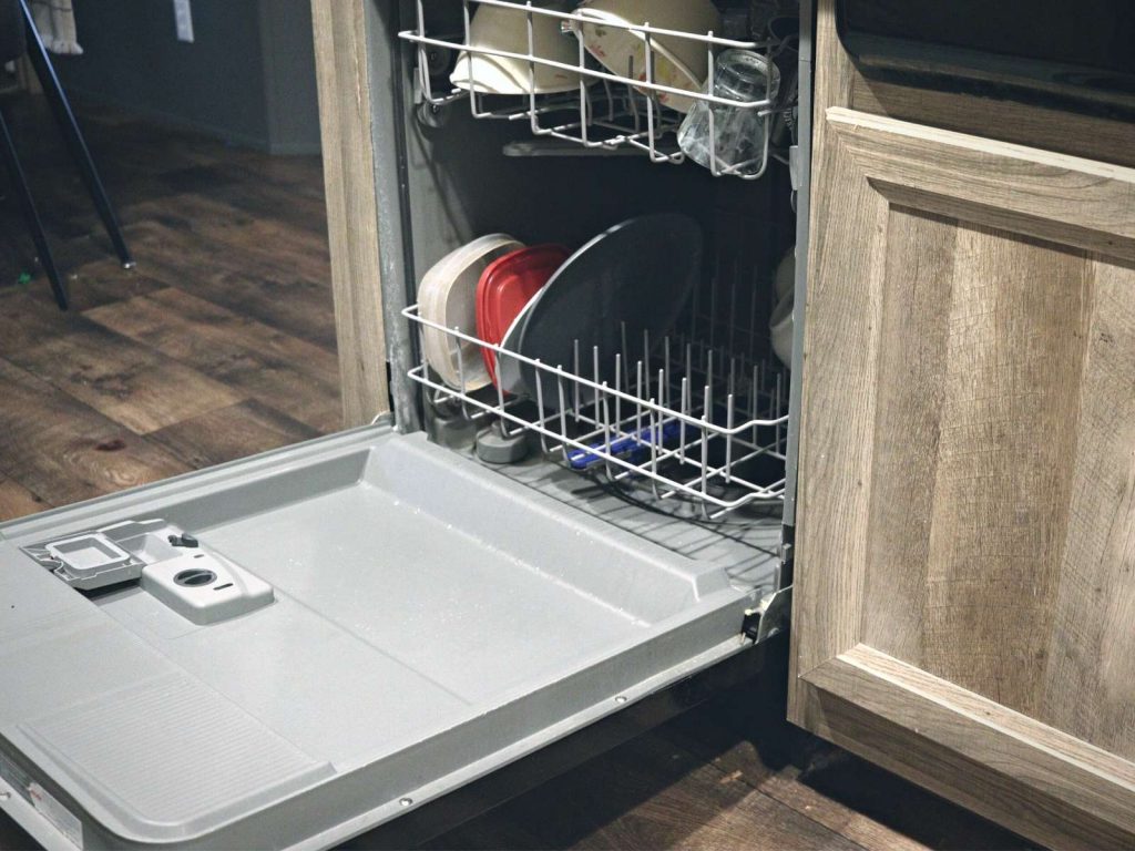 dishwasher open with dishes loaded