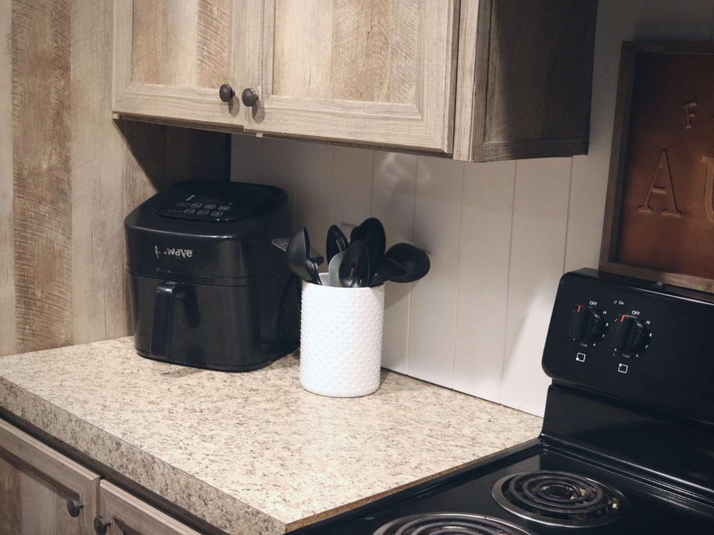 cleaned kitchen counter with air fryer and utensils