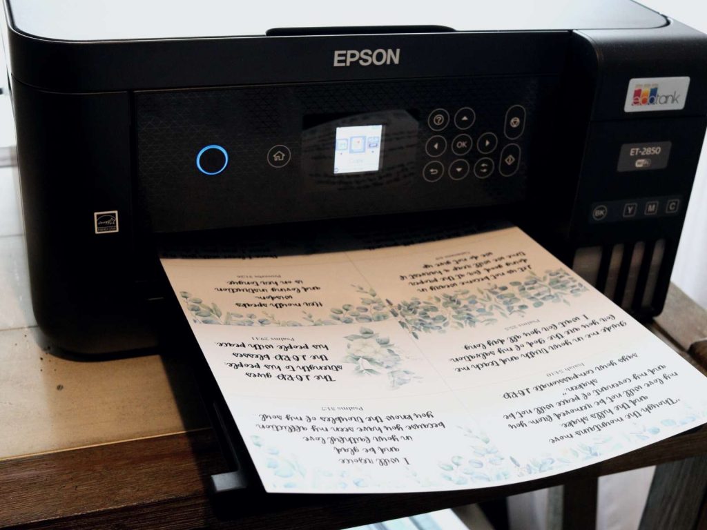 printed scripture cards sitting on tray of black epson ecotank printer