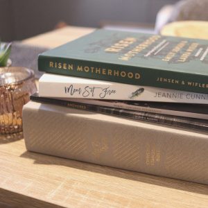 Christian motherhood book and Bible sitting on table