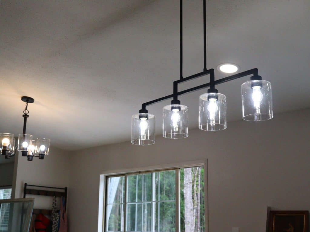 black and glass pendant island light fixture in farmhouse look