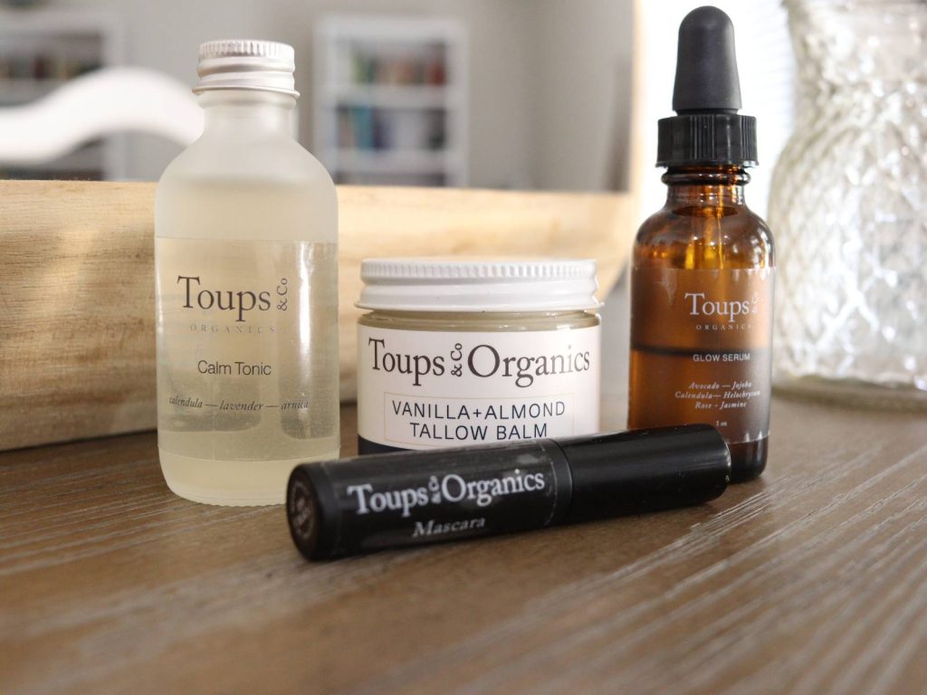 Organic non toxic skincare products from toups and co sitting on kitchen table