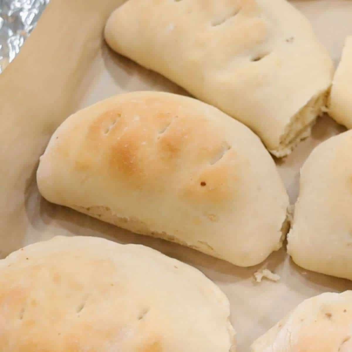 baked breakfast calzone hot pockets on baking sheet
