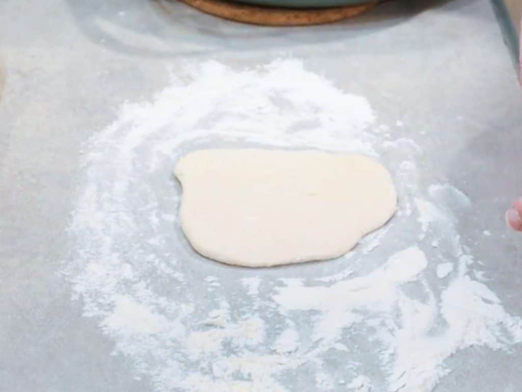 dough on floured kitchen counter