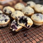 homemade blueberry muffins sitting on cooling tray