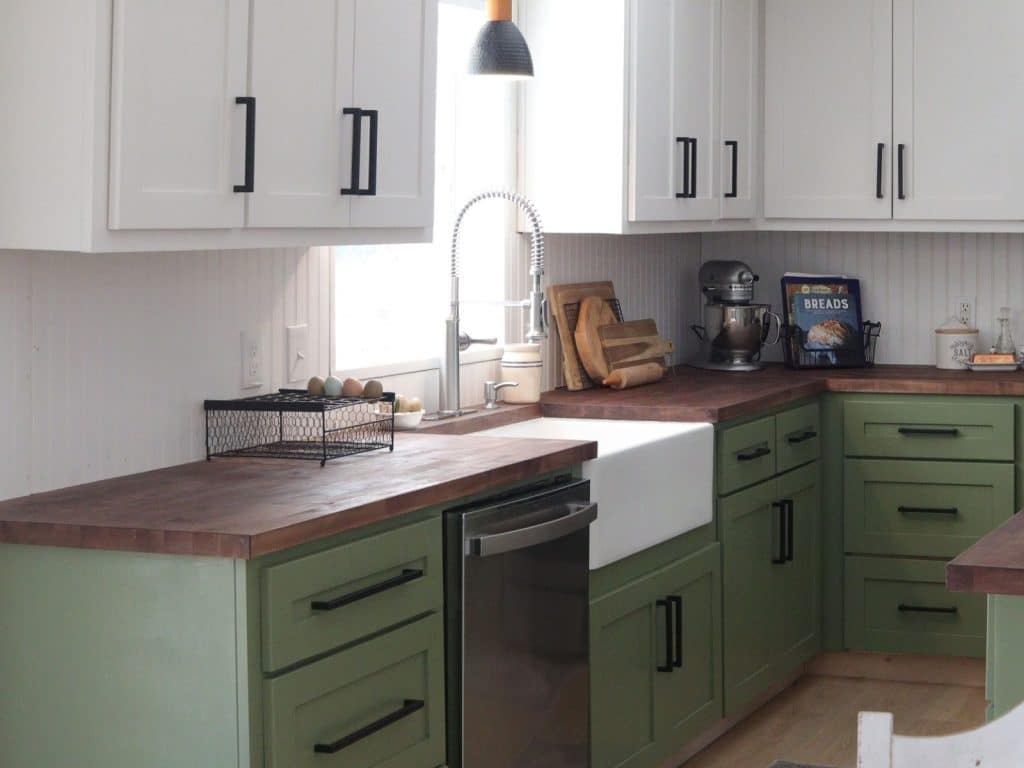 view of green and white farmhouse kitchen