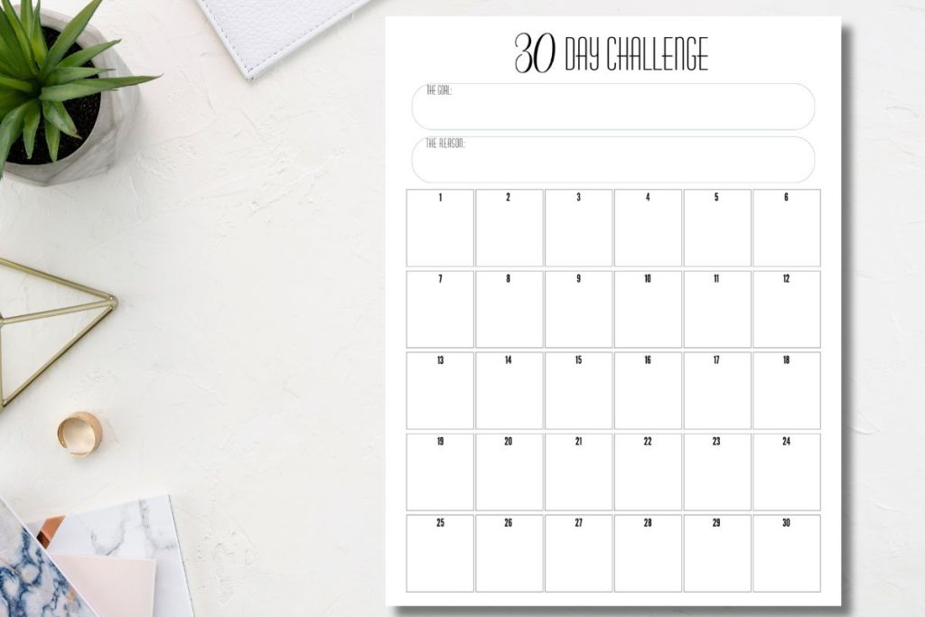 30-day challenge tracking printable on desk