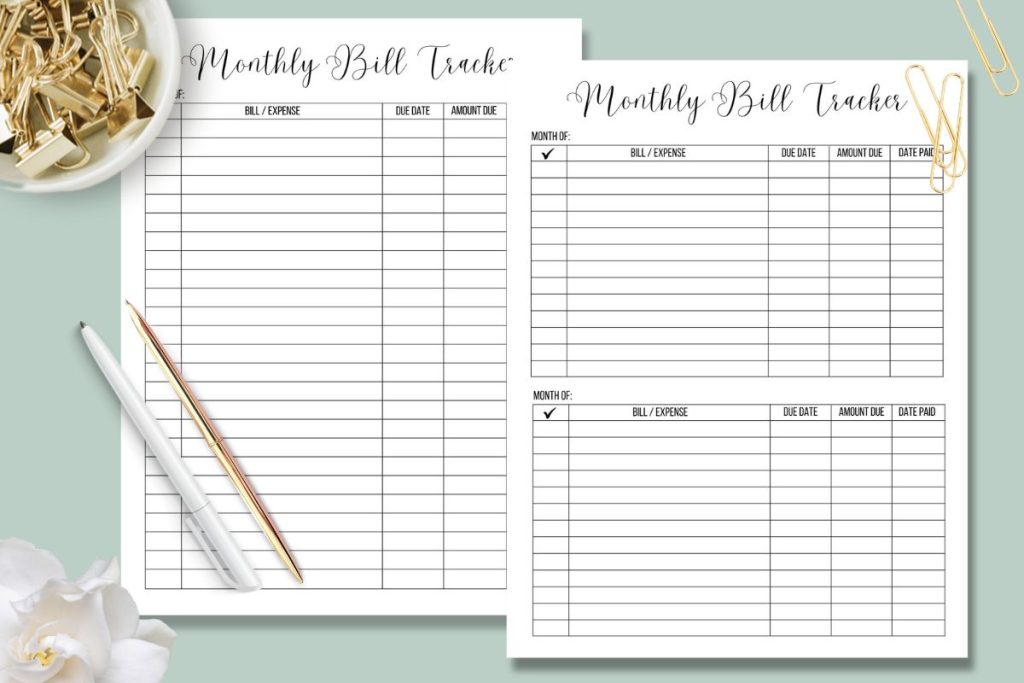 monthly bill tracker pages on light green desk with gold office supplies