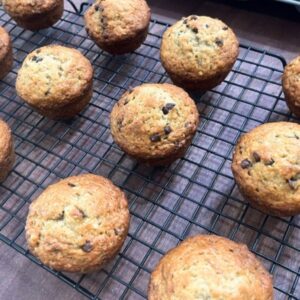 MUFFINS SITTING ON WIRE COOLING RACK