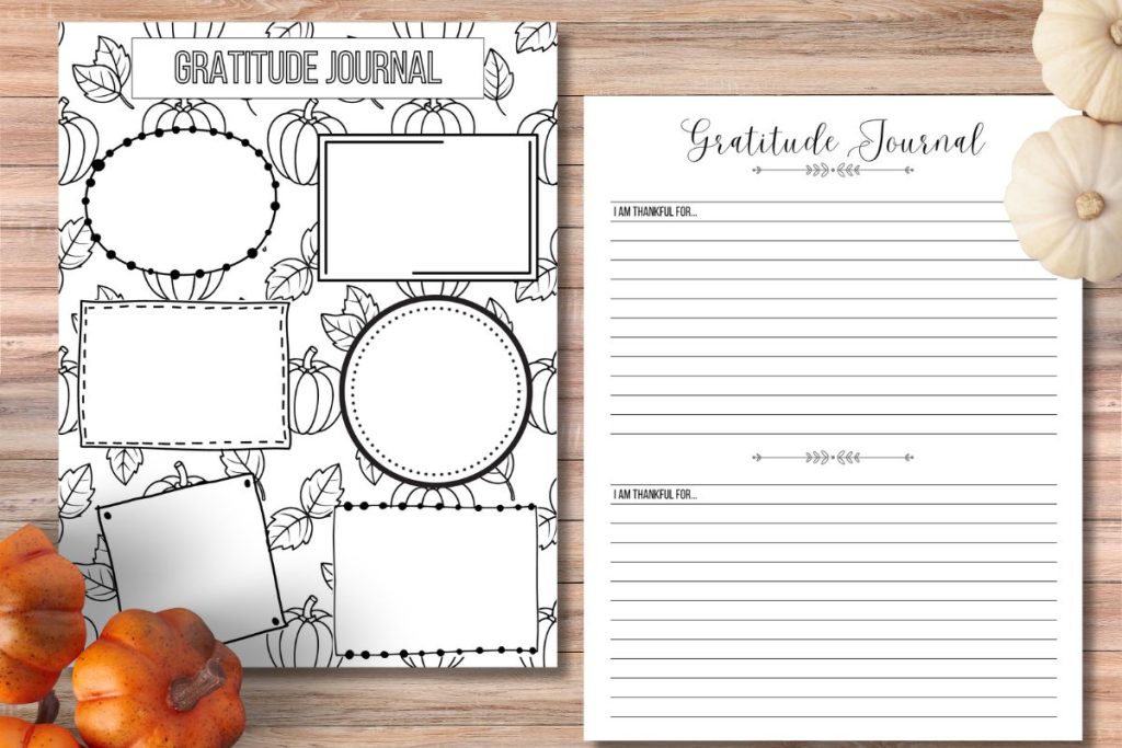 two gratitude journal pages sitting on wooden background