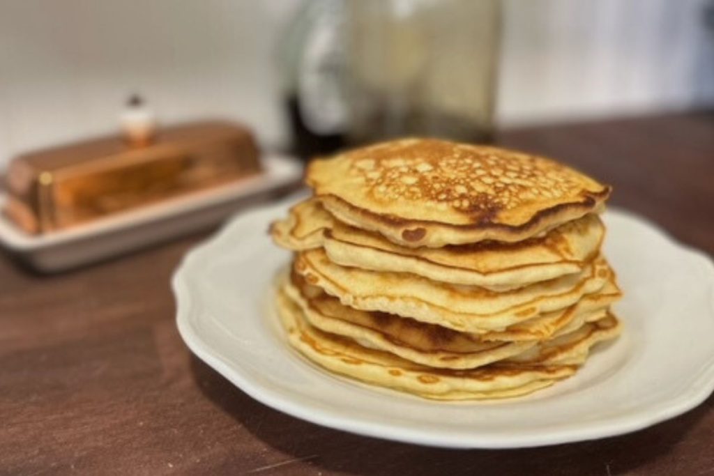 white plate with homemade pancakes sitting on it