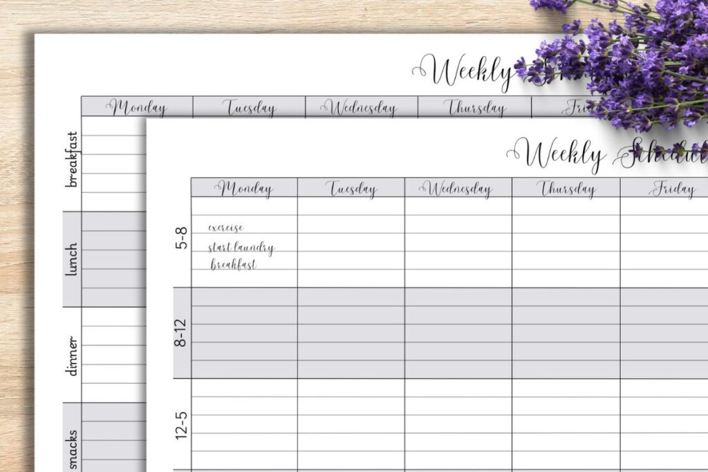 weekly schedule planner pages on wooden desk with purple flowers