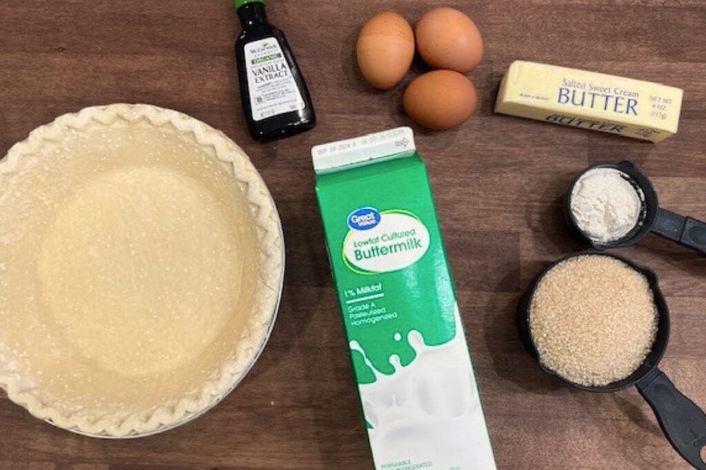 ingredients to make buttermilk pie on wooden countertop