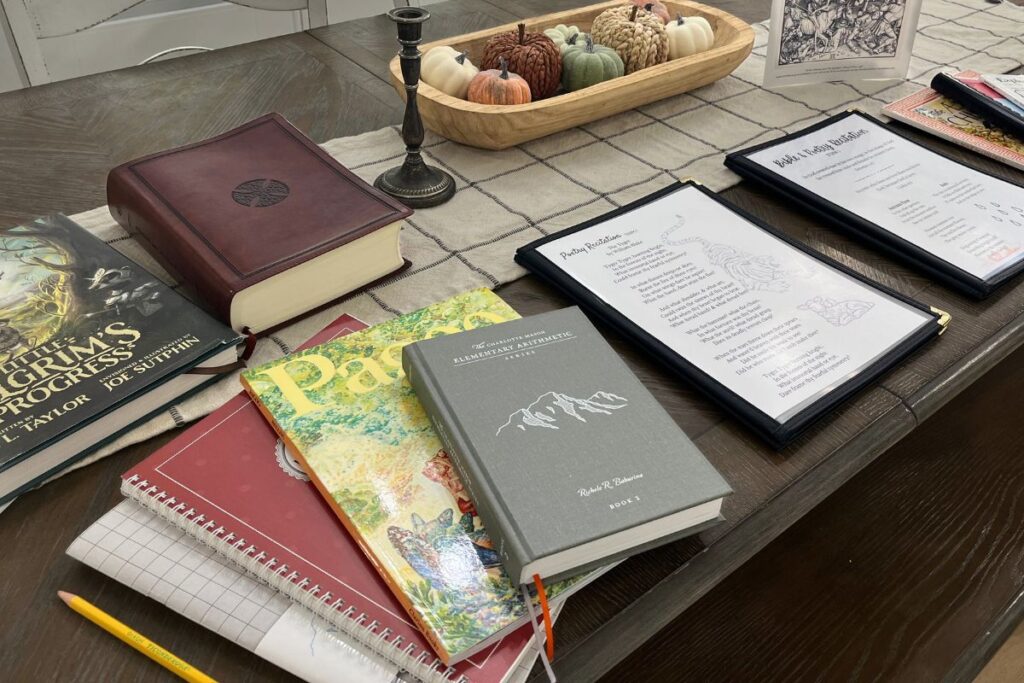 Books for homeschooling sitting on kitchen table