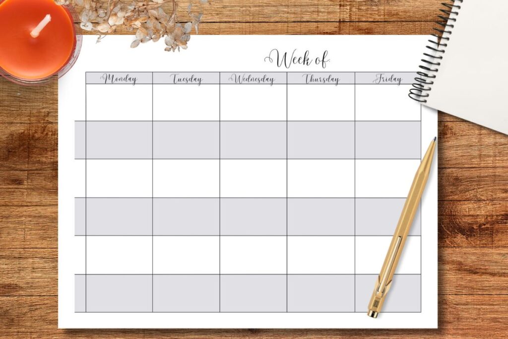 PRINTABLE WEEKLY HOMESCHOOL PLANNER ON WOODEN TABLE WITH GOLDEN PEN