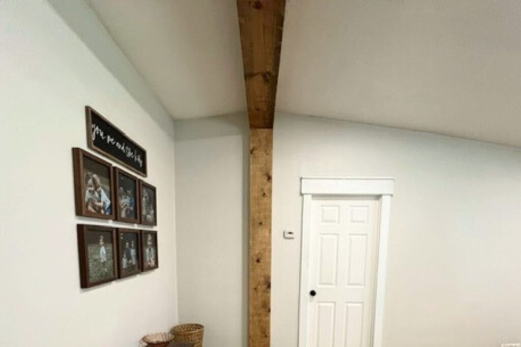 stained faux beam in mobile home livng room