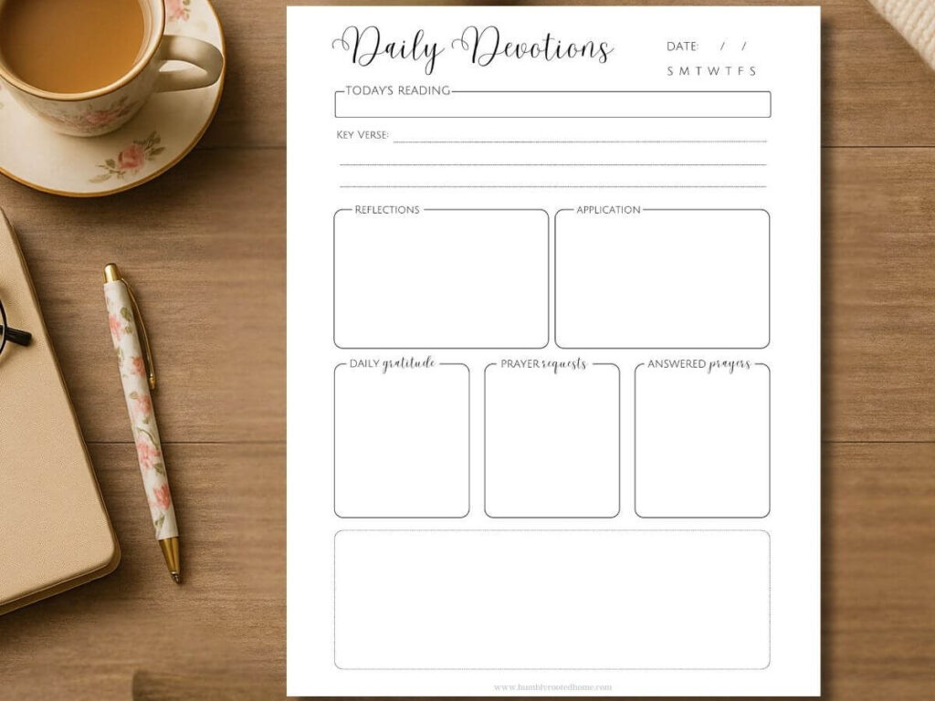 daily devotion worksheet sitting on wooden table with floral pen and tea cup next to it