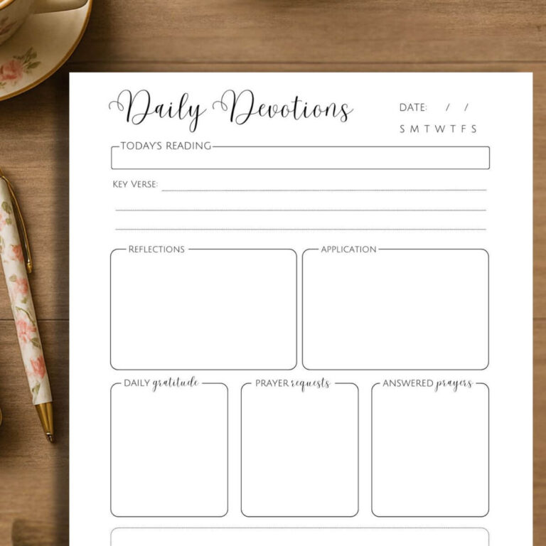 devotional journaling printable sitting on wooden desk with floral pen next to it
