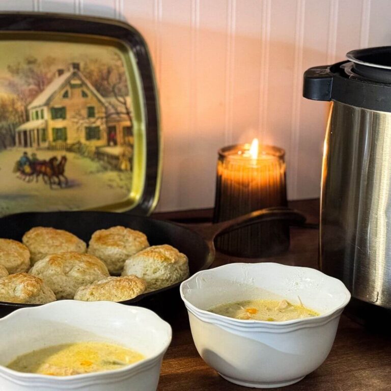 bowls of soup and skillet of biscuits sitting on counter next to electric pressure cooker